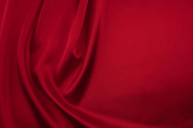 Arkaplan olarak kırmızı saten veya ipek kumaş