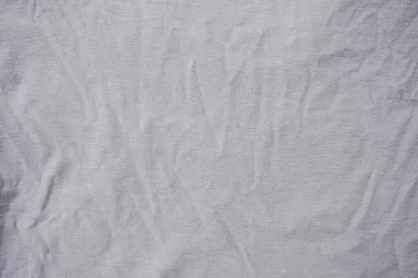 白色真丝面料 灰色棉织物背景 — 图库照片