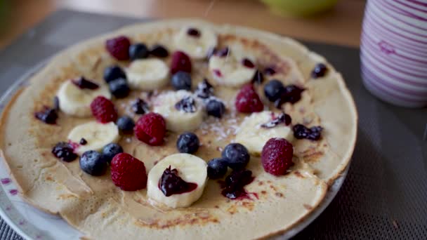 Top View Pancake Peanut Butter Spreading Fruits Banana Blueberries Raspberries — 비디오