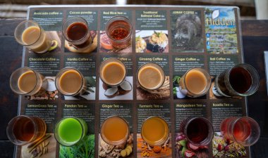 Bali, Indonesia - November 11, 2023: A variety of coffee and tea samplings displayed alongside their informative descriptions. Perfect for showcasing diverse flavors and tasting experiences. clipart