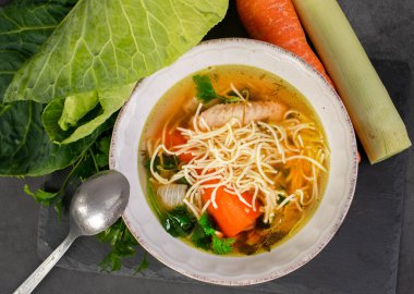 Homemade chicken soup with vegetables clipart