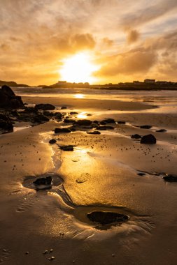 Sunset on the beach at Rhoscolyn Isle of Anglesey North Wales