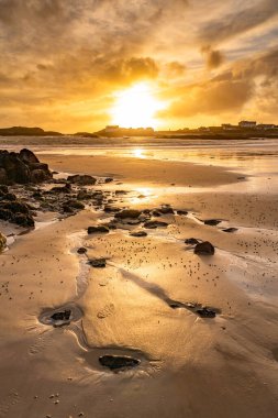 Sunset on the beach at Rhoscolyn Isle of Anglesey North Wales