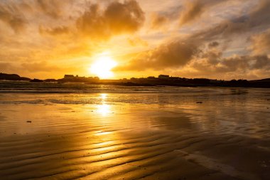 Sunset on the beach at Rhoscolyn Isle of Anglesey North Wales