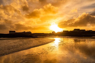 Sunset on the beach at Rhoscolyn Isle of Anglesey North Wales
