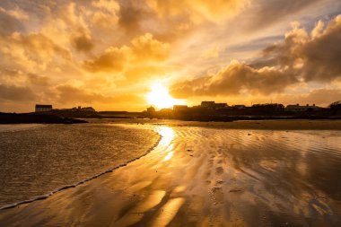 Sunset on the beach at Rhoscolyn Isle of Anglesey North Wales