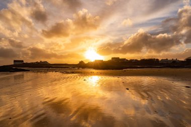 Sunset on the beach at Rhoscolyn Isle of Anglesey North Wales