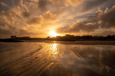 Sunset on the beach at Rhoscolyn Isle of Anglesey North Wales