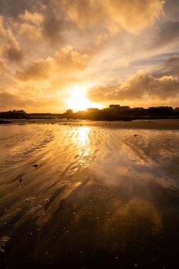 Sunset on the beach at Rhoscolyn Isle of Anglesey North Wales