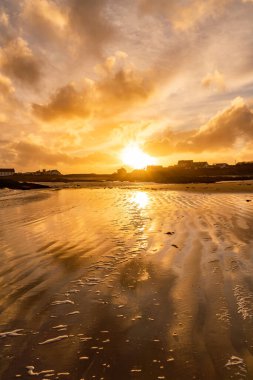 Sunset on the beach at Rhoscolyn Isle of Anglesey North Wales