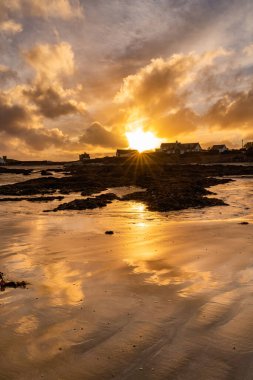 Sunset on the beach at Rhoscolyn Isle of Anglesey North Wales