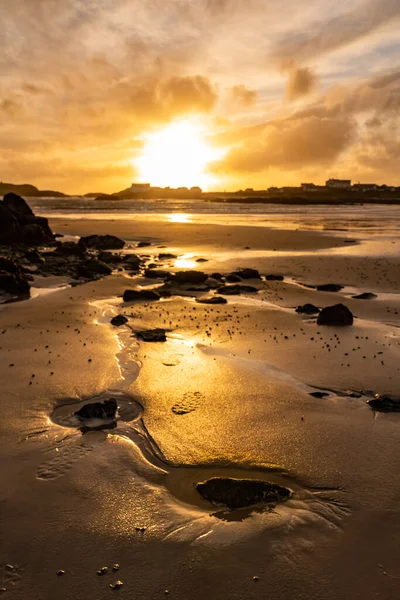 Sunset on the beach at Rhoscolyn Isle of Anglesey North Wales