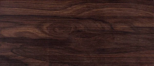 Ziricote tone wood sample sanded to a smooth finish. Ziricote Cordia dodecandra is a species from Central America and Mexico. The wood is used by Luthiers to make Guitars. This beautiful color chip use as a tileable background. Dark brown tones.