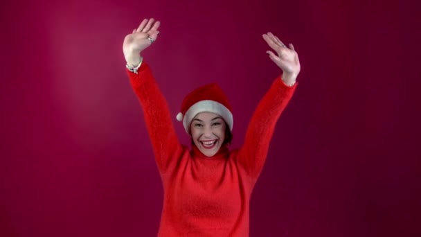 Young Positive Woman Christmas Santa Hat Isolated Red Wall Background — Stock Video