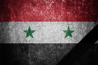 The national flag of Syria with a black mourning ribbon. Mourning in Syria.