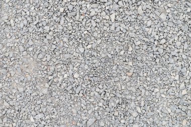 Arka plan olarak ezilmiş taş. Betonu karıştırmak için gri granit çakıl arka plan. İnşaat taşı. Pankart tasarımı