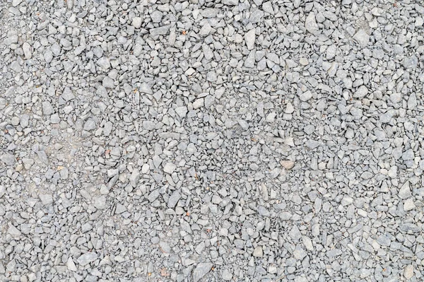 背景として砕石 混合コンクリートの灰色の花崗岩の砂利の背景 建設用の岩 バナーデザイン — ストック写真