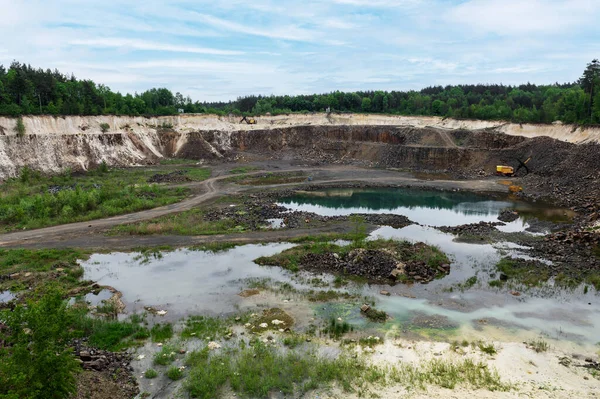 stock image Extraction of resources in a quarry. Granite quarry in the summer. Stone quarry