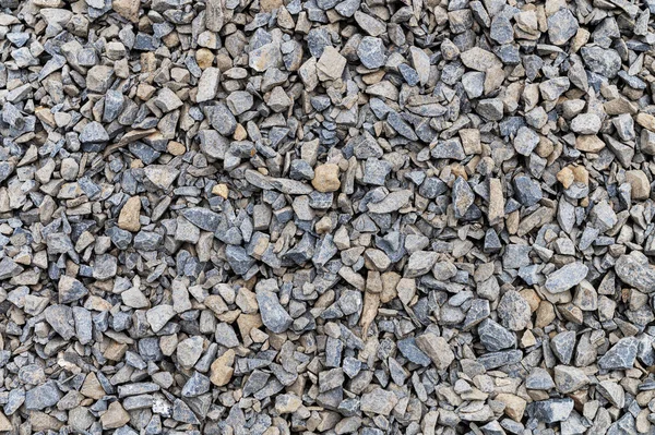 背景として砕石 混合コンクリートの灰色の花崗岩の砂利の背景 建設用の岩 バナーデザイン — ストック写真