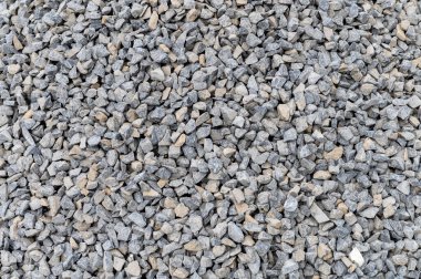 Betonu karıştırmak için gri granit çakıl arka plan. Arka plan olarak ezilmiş taş. İnşaat taşı. Pankart tasarımı