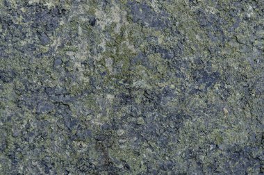 Arka plan olarak granit yüzey. Grunge taş dokusu. Bazalt. Kaya yüzeyi arkaplanı