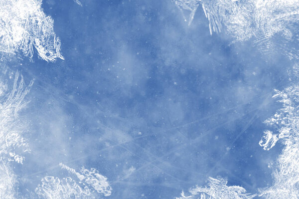Frozen pattern on winter window. Blue ice winter background, texture blue wallpaper. Fozen blue background. 