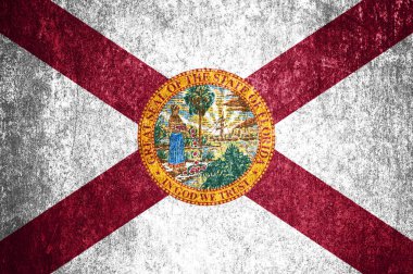 Grunge Florida eyalet bayrağına yakın çekim. Metal bir yüzey üzerinde kirli Florida bayrağı.