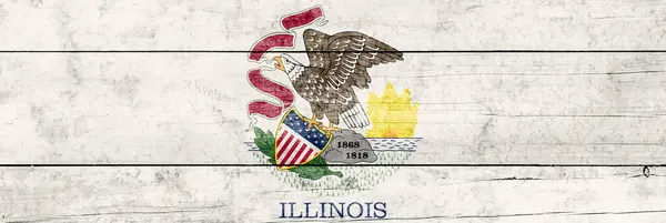 Illinois State flag on a wooden surface. Banner of the grunge Illinois State flag.