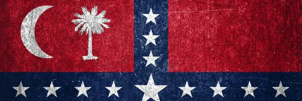 Close-up of the grunge South Carolina State  flag. Dirty South Carolina State  flag on a metal surface.