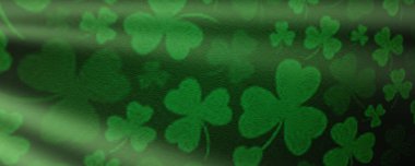 St Patricks day background. Shamrocks over a green background. Decoration for St. Patrick's Day. clipart