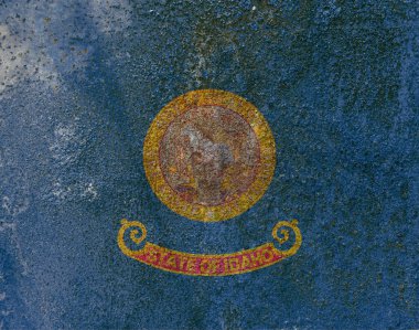 Idaho Eyalet Bayrağı. Paslı metal yüzeyinde kirli Idaho bayrağı. Paslı metal dokusu 