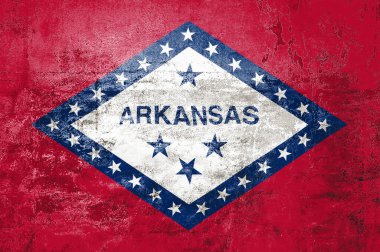 Arkansas Eyalet Bayrağı. Arkansas 'ın kirli bayrağı duvarda. Grunge duvar dokusu 