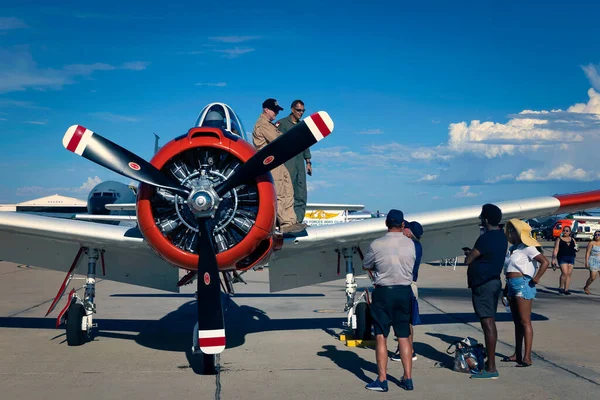 stock image Spectators talk with a pilot of a T-28 Trojan trainer at the 2022 Miramar Airshow in San Diego, California.