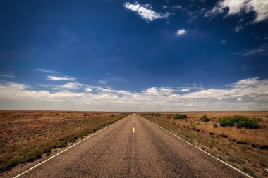 The long and flat road, better known as highway 20, heading south from Fort Sumner, New Mexico.