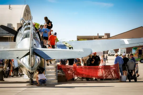 stock image Airshow fans peek in to the cockpit of TBM Avenger at the 2024 Legacy of Liberty Airshow at Holloman Air Force Base near Alamogordo, New Mexico.