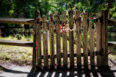 The gate to a Native American burial ground containing  the remains of 64 Chesapeake Indians dating from 800 BC to 1600 AD at First Landing State Park in Virginia Beach, Virginia. clipart