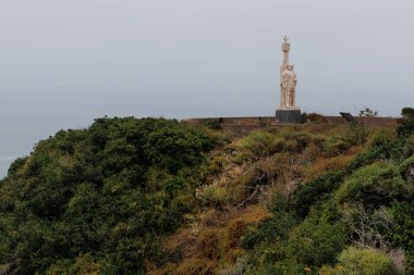 Fog on the pacific ocean behind  Cabrillo National Monument at Point Loma in San Diego, California. clipart