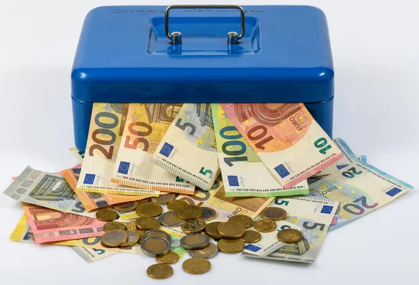 stock image euro bills and coins lying on table and sticking out of blue cash box