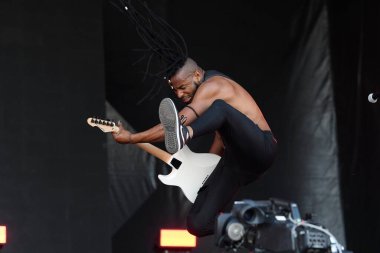 Rio de Janeiro, Brazil, September 2, 2022. Lead singer and guitarist Charles Gama of the band Black Pantera, during a show at Rock in Rio. clipart