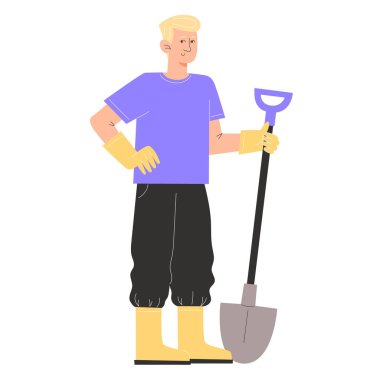 Genç bir adam bahçe kıyafetleri içinde elinde bir kürek tutuyor.