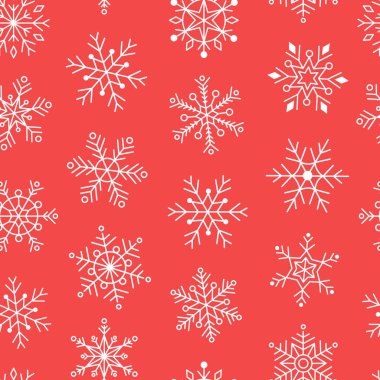 Kırmızı zemin üzerinde çeşitli kar tanelerinin pürüzsüz deseni