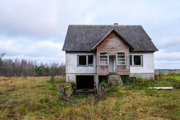 stock image Abandoned, vandalized residential building. Broken glass, slum, desolation. Defocused. High quality photo