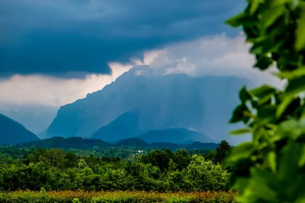 stock image Dark clouds and rain over mountains in Dolomites, Italy. High quality photo