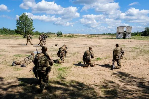 stock image Adazi, Latvia- June 11, 2024: Soldiers and national guardsmen of the Latvian army train with weapons at the Adazi training ground. Latvia is a NATO country. High quality photo