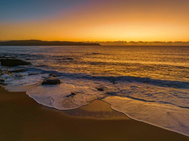 Sunrise over the ocean at North Pearl Beach on the Central Coast, NSW, Australia.