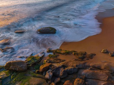 Sunrise from above over the ocean at North Pearl Beach on the Central Coast, NSW, Australia.