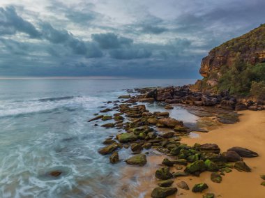Sunrise seascape with colour and clouds at Killcare Beach on the Central Coast, NSW, Australia.