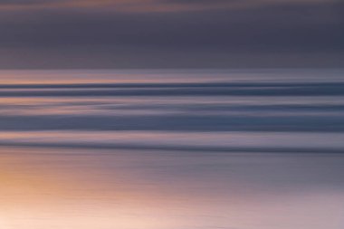Subtle abstract summer sunrise panning seascape at Umina Beach on the Central Coast, NSW, Australia.