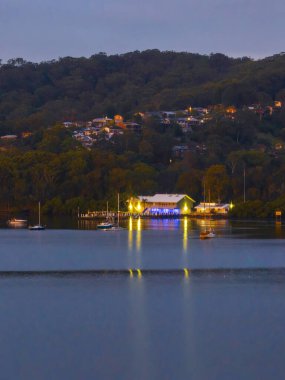 Overcast sunrise from Gosford Waterfront overlooking Marine Rescue at Point Clare on the Central Coast, NSW, Australia.