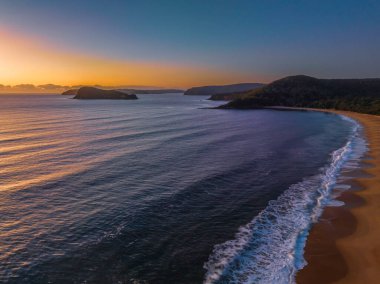 Sunrise over the ocean at North Pearl Beach on the Central Coast, NSW, Australia.